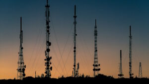 Telecommunications towers see from afar at dusk