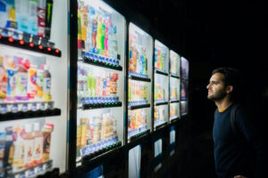 Man in front of vending machines