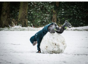 Child falling over a waist-high snowball; the network effect makes growth snowball